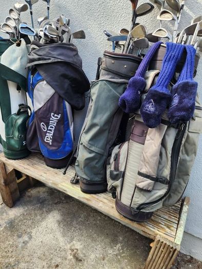 five golf bags and sixty nine clubs . ONE LOT ONLE.
