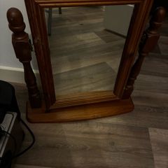 radio , mirror and book shelf