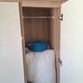 Timer and white wardrobe and bedside locker Image 5