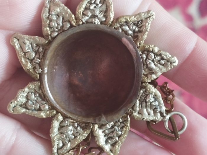 Vintage pendant on a long chain.