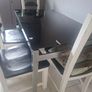 Black Glass Table And 4 Black And White Wooden Chairs Image 4