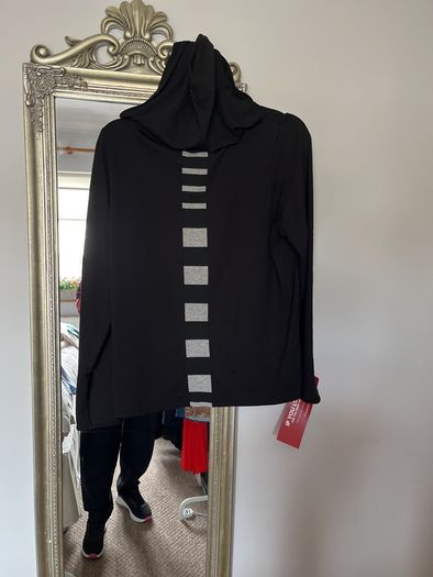 Naya black hooded top with white piping and design down back