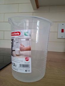 Plastic measuring glass