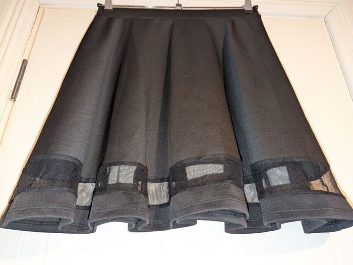 Gorgeous big pleat midi skirt with see through panel at bottom