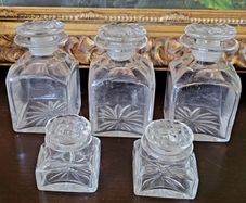 Antique set of five cut glass scent bottles