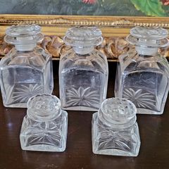 Antique set of five cut glass scent bottles