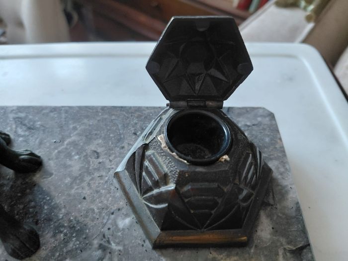 Antique desk inkwell with a seated dog on marble stand