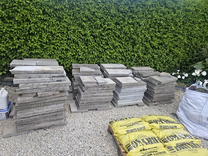 30sq m used 300mm x 600mm paving slabs & paving sand