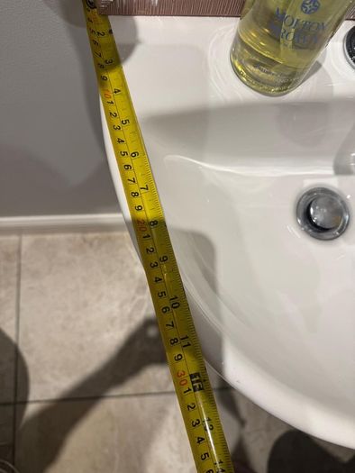 Bathroom sink, toilet, radiator