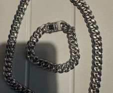 silver  colour bracelet and necklace
