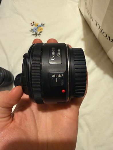 Canon EOS 250D DSLR Camera with + 50mm lens +18-135mm lens + and selfie tripod.