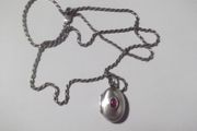 a silver locket with a silver chain