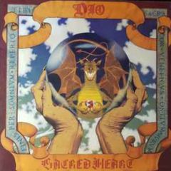 DIO Sacred heart original1985  Rare Irish translucent version. Vinyl goes golden brown when a bright light is shining through it. Has original inner lyric sheet vinyl record