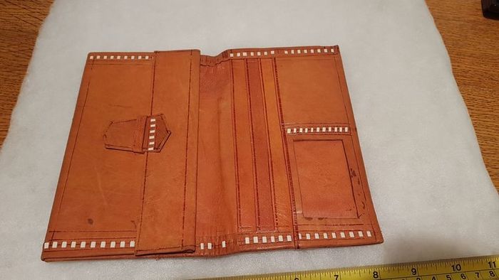 handcrafted made soft leather wallet,with designs ,, thank you,,was used,some wear and tear,,take as is ..