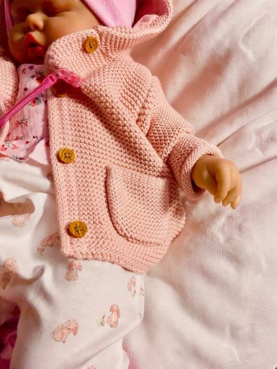 doll.       Reborn baby doll very cute COMES WITH A XMAS OUTFIT