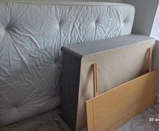 double bed with mattress and headboard