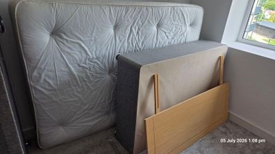 double bed with mattress and headboard