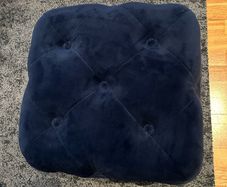 Navy blue velvet upholstered cube pouffe
