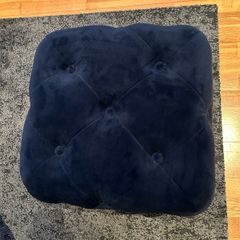 Navy blue velvet upholstered cube pouffe