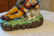 Figurine  man and his dog.