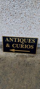 Antiques & Curios,hard plastic sign perspex. ,unusual and lovely colours,,32 inches length, 16 inches height,,buyer collects, see pictures for condition, used condition few marks nicks