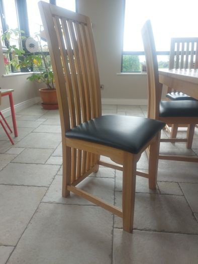 solid oak dining table and chairs