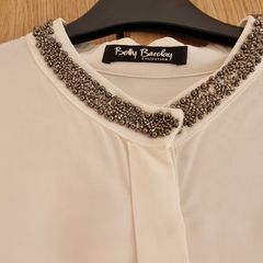 Silk style top with embellished neckline