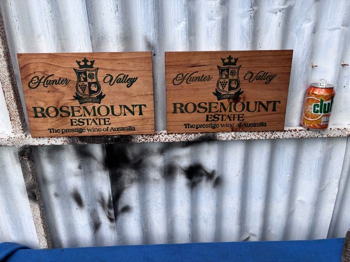 Matching pair of wooden wine plaques