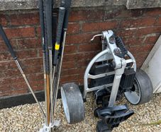 Golf clubs and trolley
