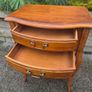 vintage French Provincial or Louis XV-style wooden bedside table/side chest featuring two drawers, cabriole legs, and a lower open shelf Image 3