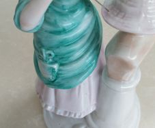 Vintage ornament of lady milliner hat maker