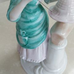 Vintage ornament of lady milliner hat maker