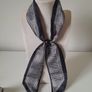 Black and white patterned neck scarf Image 2