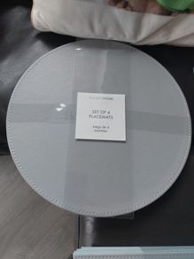 Sets of 4 circular placemats. Grey / duck egg.
