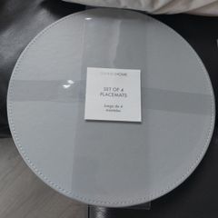 Sets of 4 circular placemats. Grey / duck egg.