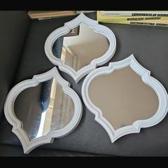 Three small mirrors