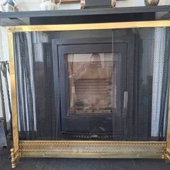 Antique brass fire gaurd and bronze fire set.