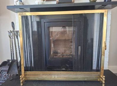 Antique brass fire gaurd and bronze fire set.