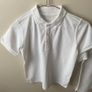 2 dunnes white polo shirts (as new) age 9-10 Image 2