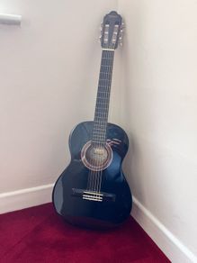 Valencia left-handed acoustic guitar and bag