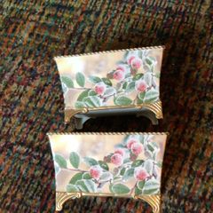 2 vintage decorative painted metal planters with legs.