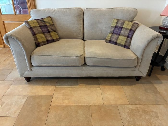 Two-seater sofa with matching storage footstool