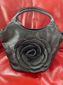 Handbag dressy occasional crossbody bag. Black Medium Size hand bag With Large Flora Feature . Detachable strap. Excellent Condition. Bought In Toulouse.