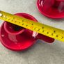 Set of 2  Red enamel candlestick holder and drip tray featuring a Considered by Helen James 12.00 euro each. Image 3