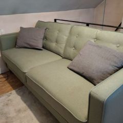 Green three seater sofa