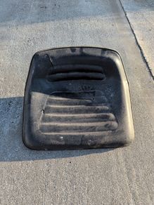 Old ride on lawn mower seat.