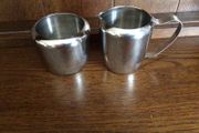 Stainless steel milk jug and sugar bowl