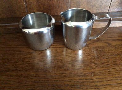 Stainless steel milk jug and sugar bowl