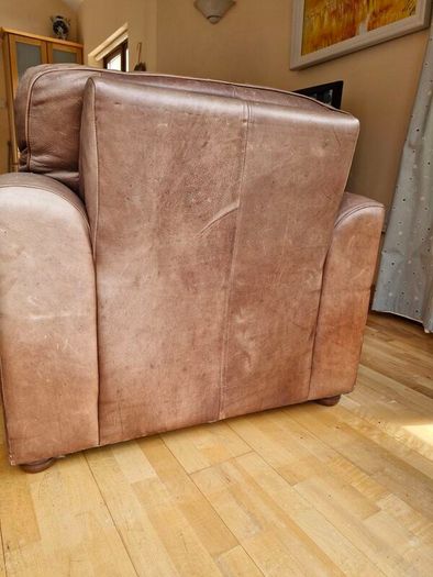 brown leather sofa and arm chair