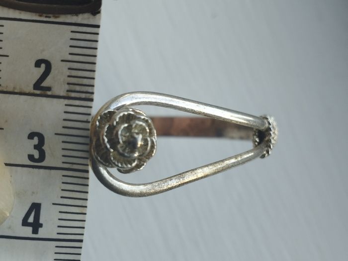 Vintage sterling silver bracelet with a rose-shaped clasp.